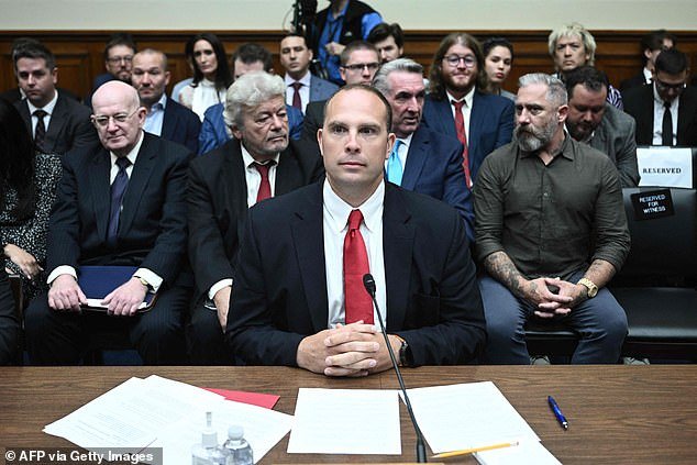 Former US Air Force officer and intelligence official David Grusch, a UFO whistleblower, have alleged that the US is engaged in secret UFO crash-retrieval and reverse-engineering programs (Pictured: Grusch testifying to Congress in July 2023)